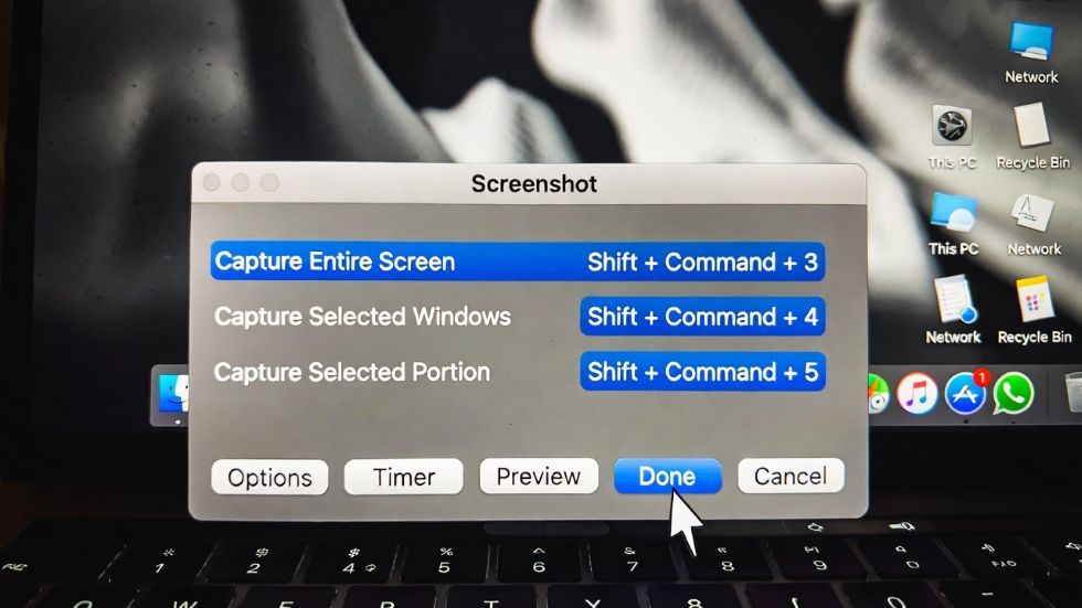 macbook screen showing the screenshot toolbar with shortcuts highlighted